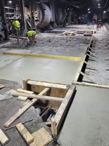 Concrete being poured for automatic pour line